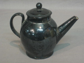 An 18th Century black glazed pottery teapot and associated lid 5"