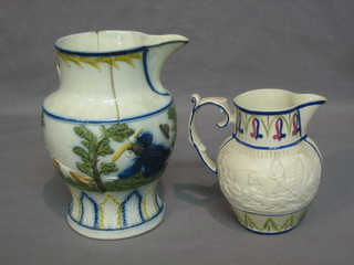 An 18th Century Majolica style jug decorated hunting scenes 7" (cracked) and a 19th Century jug decorated shooting scene (cracked) 5"