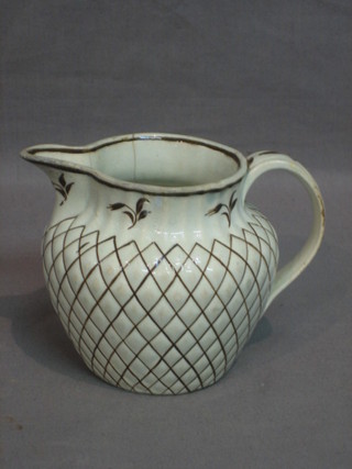 An 18th/19th Century white glazed pottery jug with brown lattice work decoration 4" (cracked)