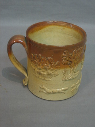 A salt glazed harvestware mug decorated a hunting scene 4"