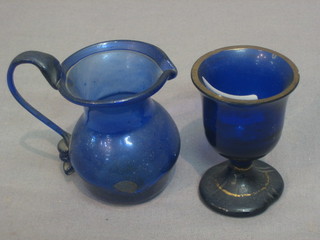 A Bristol blue glass egg cup 3" and a blue glass jug 3"