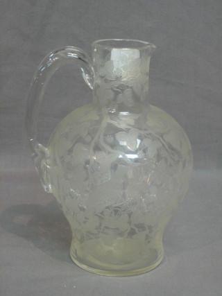 A Victorian etched glass ewer 8"