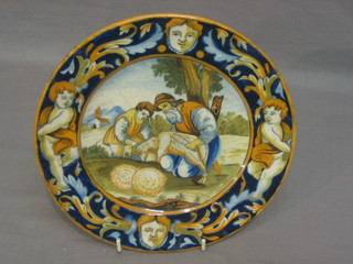 An Arborello Majolica plate decorated a shepherd shearing, monogrammed M 8" (some crazing)