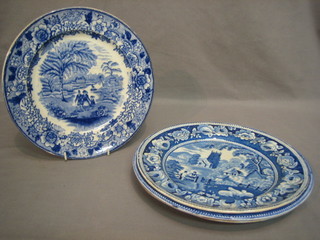 A blue and white plate decorated a Doctor in cart and 3 other blue and white plates