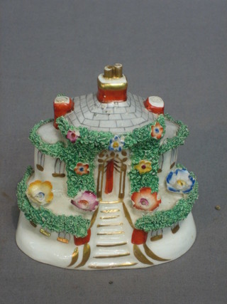 A 19th Century Staffordshire model in the form of a cottage 4"