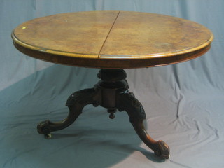A Victorian circular figured walnut Loo table (split to top), raised on a carved column base, 47"