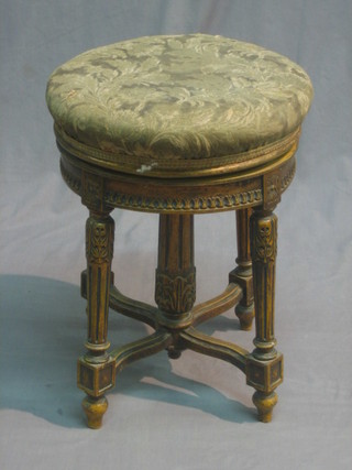 A Victorian carved wood and gilt painted circular, revolving adjustable piano stool