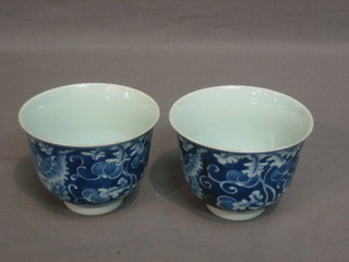 2 Oriental blue and white rice bowls with floral decoration, the base with 6 character mark 4"