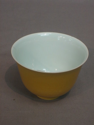 An Oriental white and yellow glazed rice bowl, base with 6 character mark, 4"