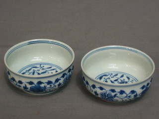 A pair of Oriental circular blue and white porcelain bowls, bases with 6 character figure mark 3"