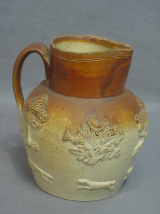 A Harvestware jug decorated a Windmill and hunting scenes 6"