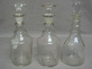 A pair of 19th Century club shaped decanters and stoppers and 1 other 8"
