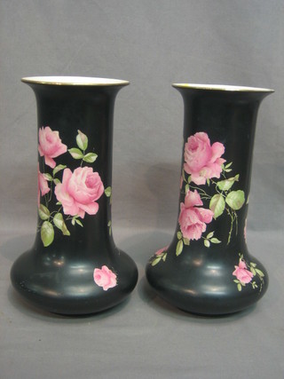 A pair of Ducal black glazed and floral patterned club shaped vases 10"