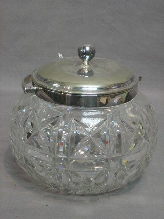 A circular cut glass biscuit barrel with silver plated mounts 6"