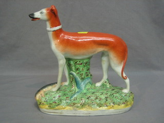 A Staffordshire figure of a standing greyhound (f and r) 10"