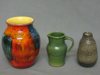 A Poole Pottery Atomic orange vase 6", a brown glazed Art Pottery vase 4", a green glazed Art Pottery jug 4"