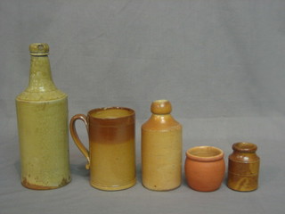 A salt glazed tankard and various salt glazed bottles and flagons