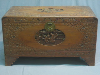 A 19th/20th Century carved camphor wood coffer with hinged lid, raised on bracket feet 40"