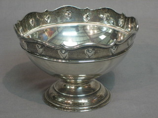 An Edwardian circular silver pedestal bowl with wavy border and embossed decoration, Sheffield 1906, 12 ozs