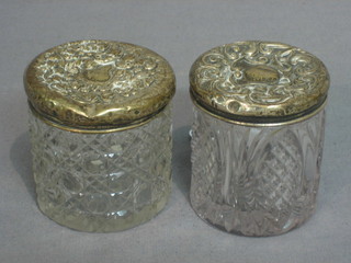 2 cylindrical cut glass dressing table jars with silver lids 3" (lids dented)