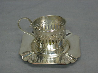 A square silver plated ashtray, a silver plated glass holder and etc
