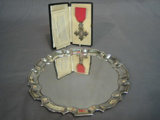 A breast badge of a member of Most Excellent Order of The British Empire, second type  Captain E A Fern together with warrant and a silver plated salver presented by Internment Camp and Parole Centre Satara together with various photographs