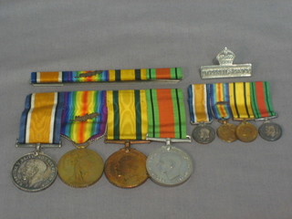 A group of 4 medals to 690 Gunner A Fern Royal Artillery comprising British War medal, Victory medal with mention in dispatches, Territorial Forces War medal and Defence medal together with a group of miniatures, a medal bar and a privately engraved Imperial Service badge