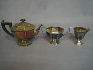 An Art Deco octagonal silver plated 3 piece tea service with teapot, twin handled sugar bowl and milk jug