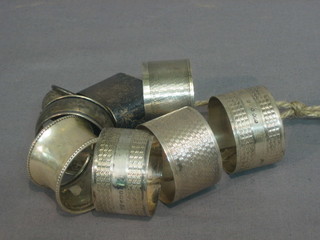 8 various silver napkin rings 5 ozs