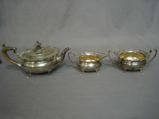 A circular Georgian style 3 piece silver tea service with teapot, twin handled sugar bowl and cream jug, Birmingham 1918, 37 ozs 