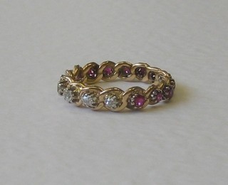 A lady's gold ruby and diamond full eternity ring