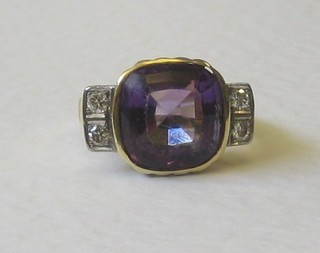 A gold dress ring set a square cut amethyst and 4 diamonds