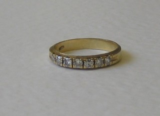 A gold half eternity ring