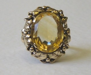 A gold dress ring set an oval cut citrene