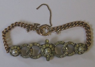 A lady's gold bracelet set white stones and seed pearls