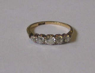 A lady's gold dress/engagement ring set 5 graduated diamonds