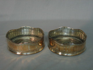 A pair of circular silver plated wine coasters 5"