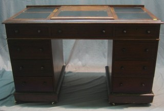 A Victorian mahogany kneehole pedestal desk with inset tooled leather writing surface fitted a hinged lid and recess, the base fitted 1 long dummy drawer and 8 short drawers, 49"