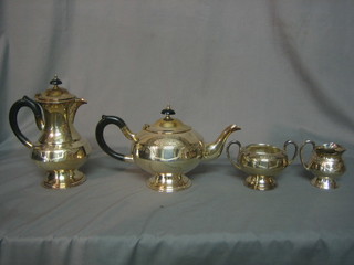 A  silver plated 4 piece tea service with teapot, hotwater jug, twin handled sugar bowl and milk jug