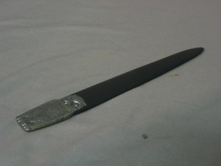 An ebony letter opener with silver decoration depicting an owl 9 1/2"