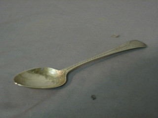A George III silver fiddle pattern spoon with bright cut decoration Edinburgh 1790