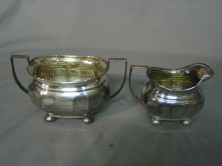 A Georgian style silver plated twin handled sugar bowl and cream jug