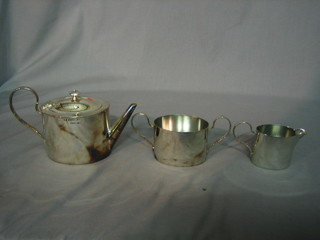 An oval silver plated 3 piece tea service with teapot, twin handled sugar bowl and milk jug