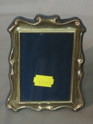 A silver easel photograph frame 4 1/2" x 3 1/2" and 1 other