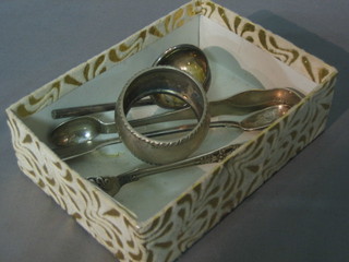 A pair of Victorian silver sugar tongs, a Victorian silver pickle spoon, a silver napkin ring and a ladle