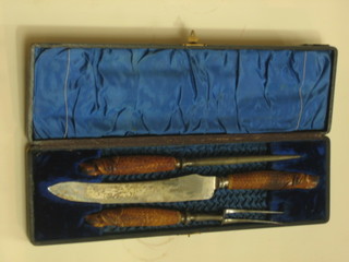 A  3 piece carving set and a 2 piece stag horn carving set the handles carved dogs heads