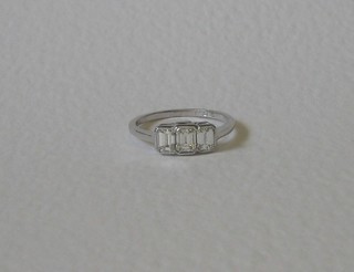 A lady's 18ct white gold dress/engagement ring set 3 baguette cut diamonds approx 1.25ct