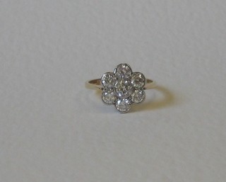 A lady's 18ct yellow gold floral cluster dress ring set 7 diamonds, approx 1.35ct