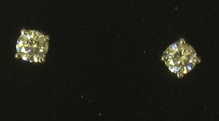 A pair of diamond set ear studs approx 0.60ct