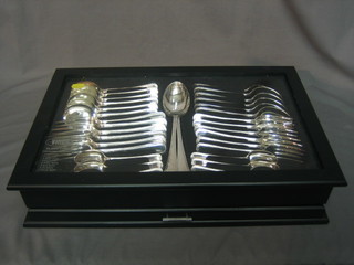 A 44 piece canteen of Old English pattern silver plated flatware with bead edging comprising 6 table knives and forks, dessert knives, dessert forks, dessert spoons, soup spoons, tea spoons and 2 serving spoons